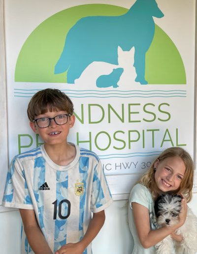 Kids taking their dog to the Vet - Kindness Pet Hospital in Santa Rosa Beach Florida