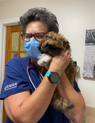 Mary holding a Maltipoo - Kindness Pet Hospital in Santa Rosa Beach Florida